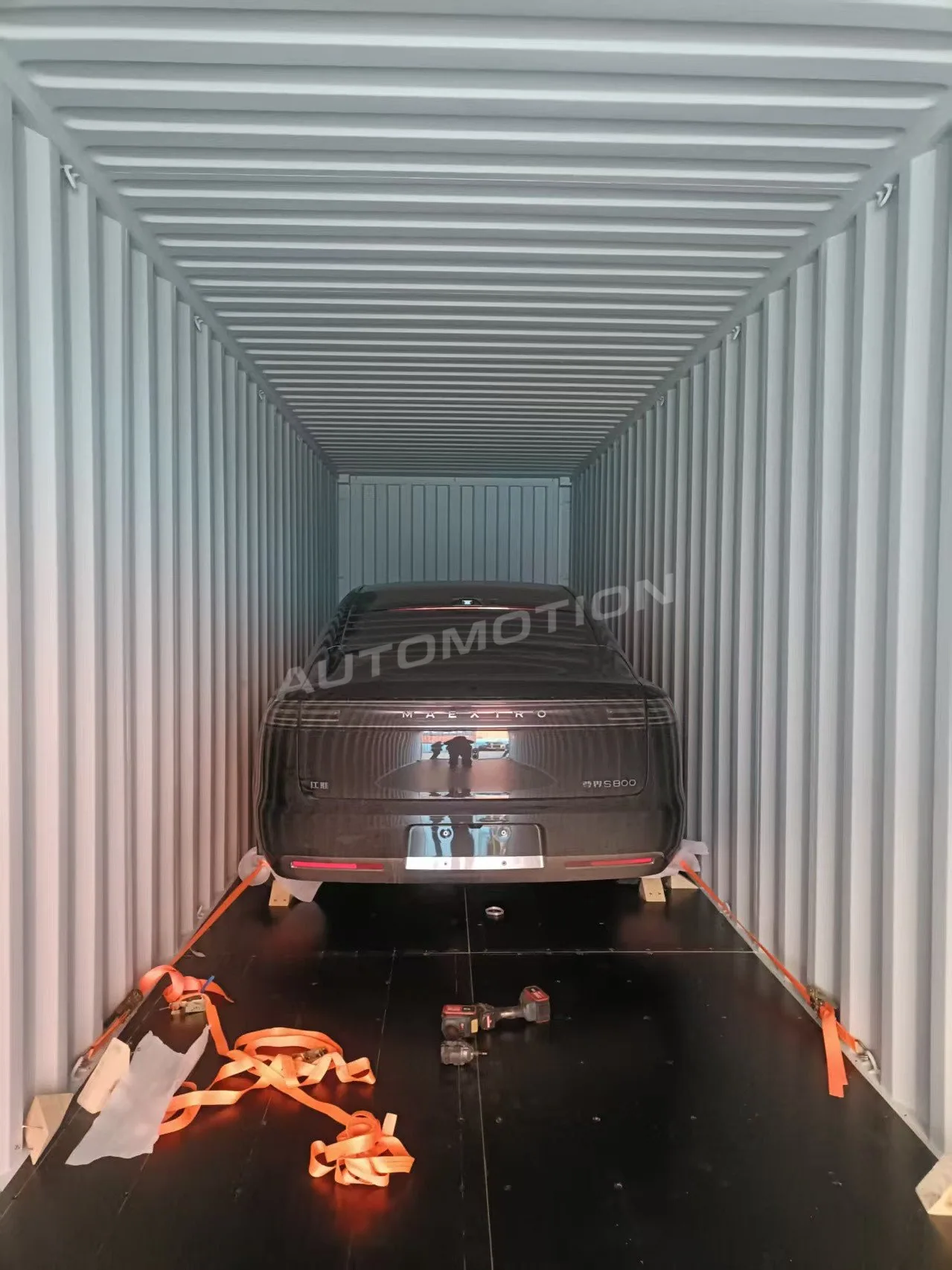 Delivery photograph 5 of 8, a vehicle loaded in a shipping container